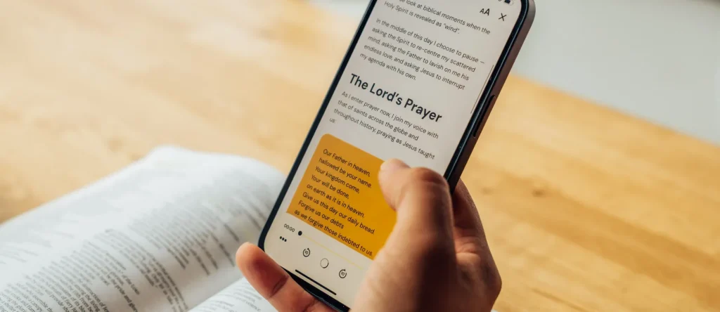 Phone showing daily devotional using the Bible to pray